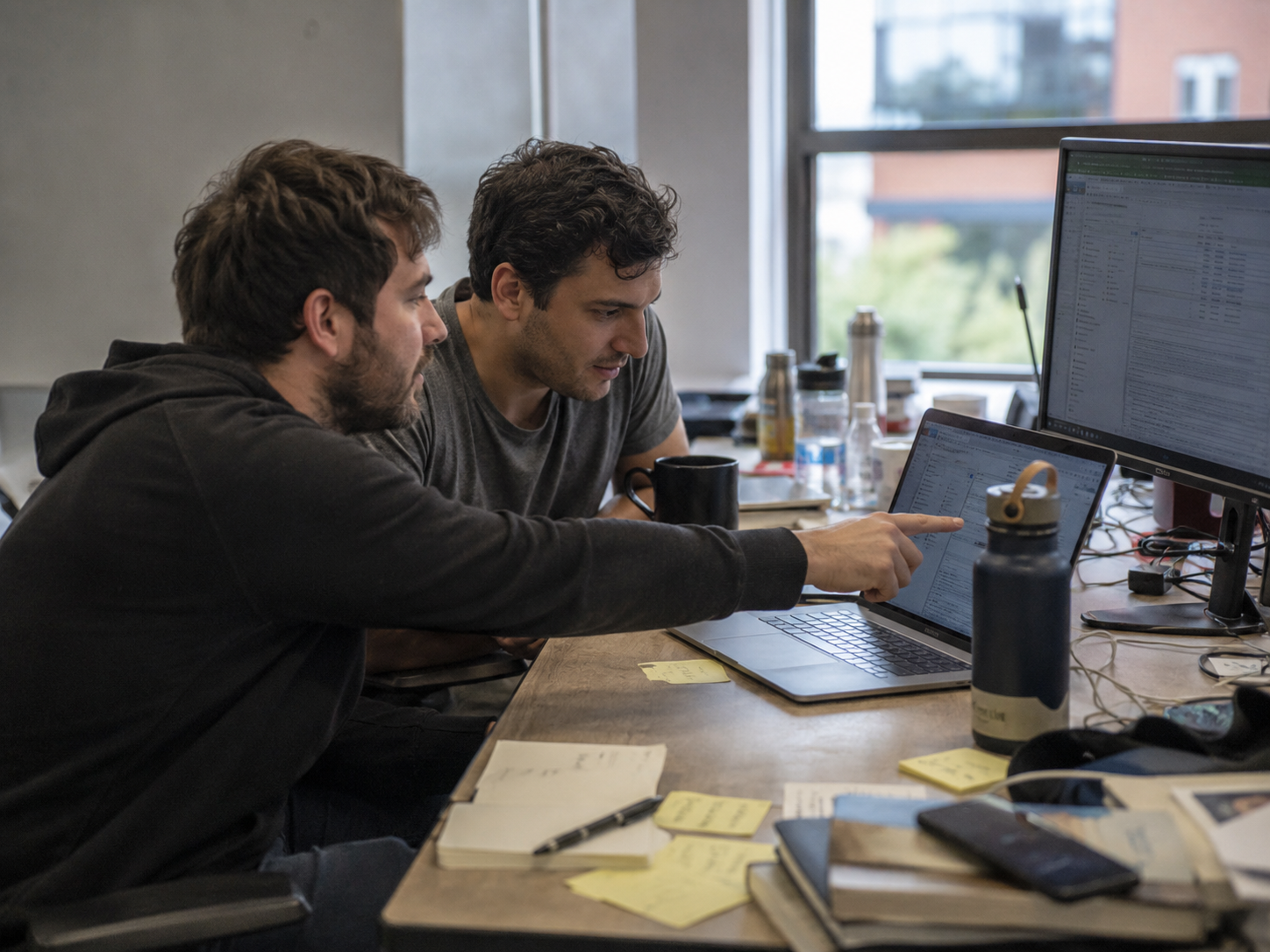 Two people working at a desk